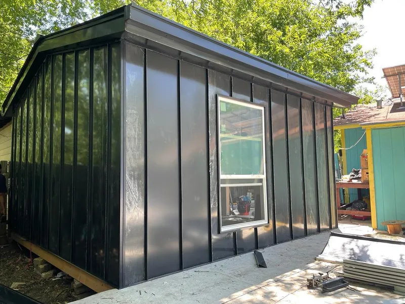 Black standing seam metal wall panels for Metal Roof Installation in Rochester